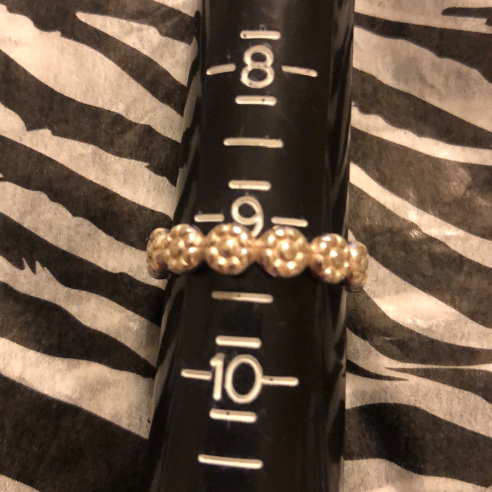 Sterling silver ring with little flowers all round
